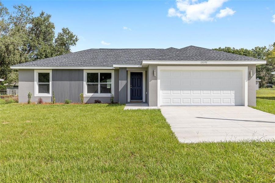 Front exterior of a new home in , Dunnellon, FL, highlighting curb appeal (Image 15).