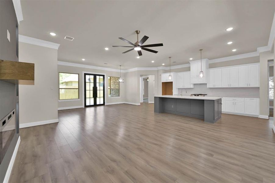 Similar View from the Front Door to The Kitchen and Living Area of a Home Built by TX Best Home Builders