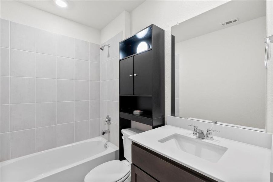 Full bathroom featuring vanity and shower / washtub combination