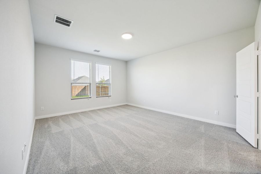 Primary Suite in the Masters home plan by Trophy Signature Homes – REPRESENTATIVE PHOTO