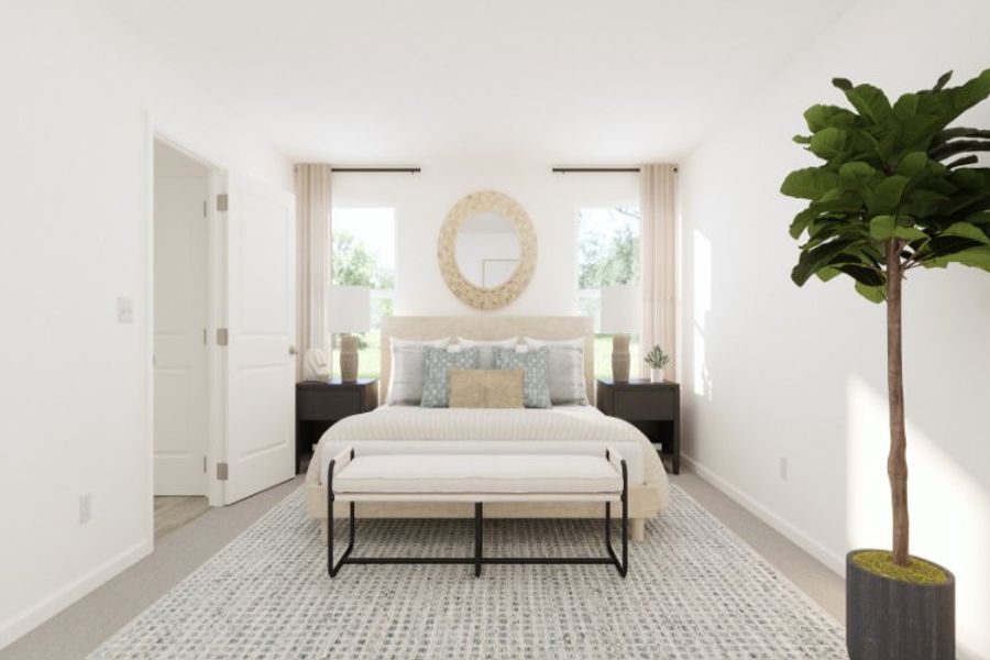 A bedroom with a bed and a table. A bedroom with a bed and a table.