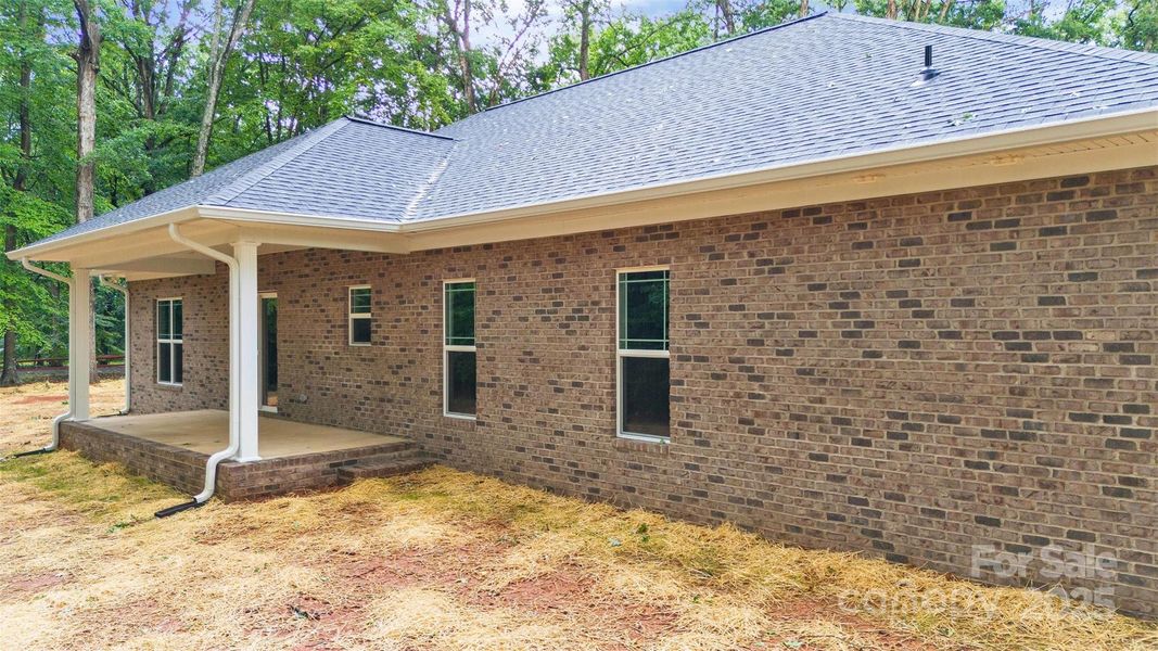 Front exterior of a new home in , Mocksville, NC, highlighting curb appeal (Image 20).