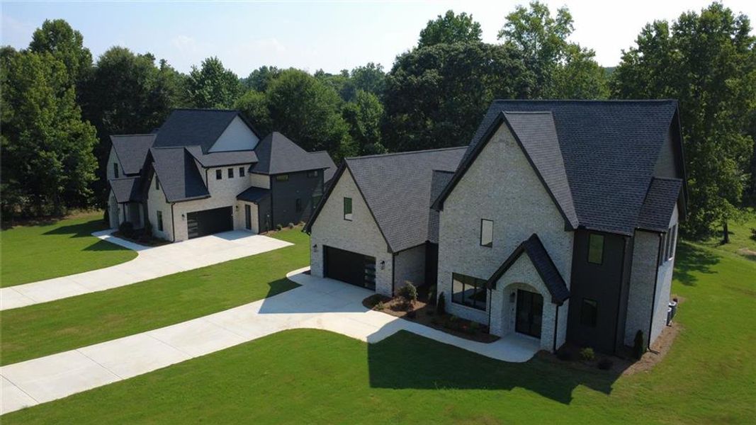 Front exterior of a new home in , Flowery Branch, GA, highlighting curb appeal (Image 27).