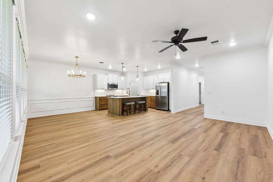 An open concept design seamlessly connects a gourmet kitchen to the living areas, creating an inviting space for gatherings. An open concept design seamlessly connects a gourmet kitchen to the living areas, creating an inviting space for gatherings.