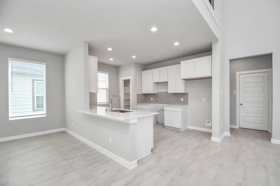 Welcome to a dream kitchen that exceeds expectations! Sample photo of completed home with similar floor plan. Actual colors and selections may vary.