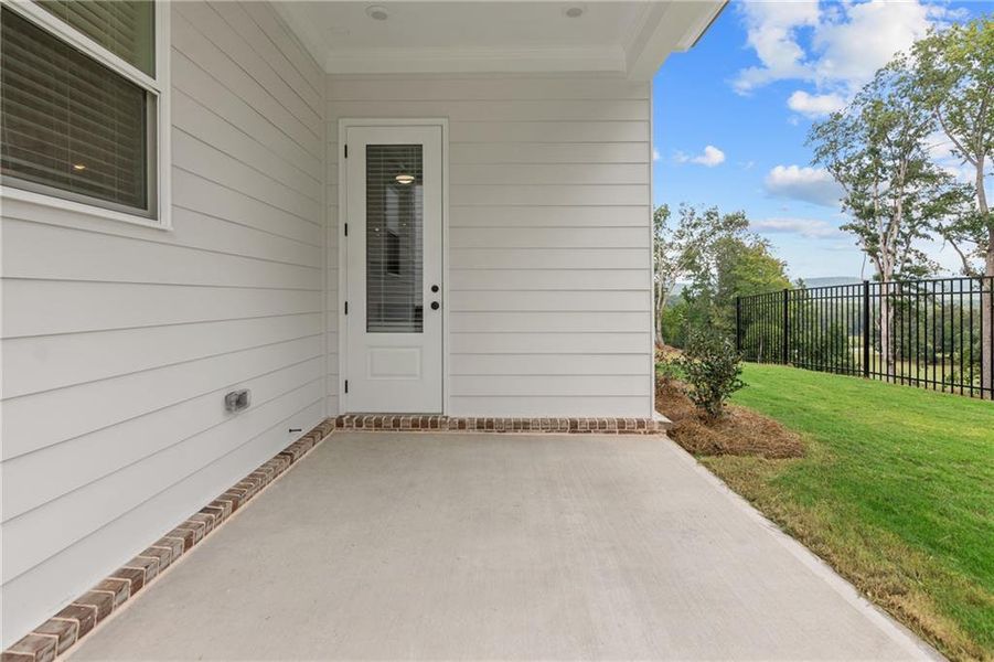 Exterior details and patio area of a home in Palisades Single Family, Cumming (Image 3). Exterior details and patio area of a home in Palisades Single Family, Cumming (Image 3).