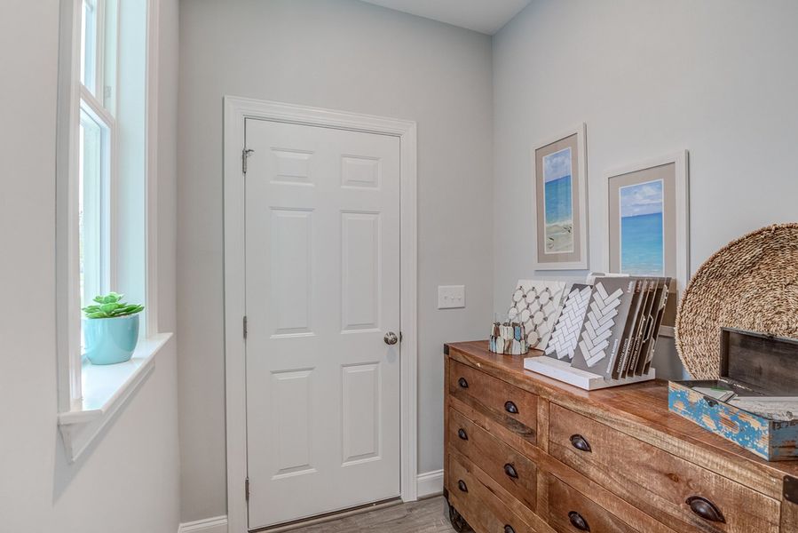 Representative furnished interior of a home built from the The Amherst by RobuckHomes in Windwater, Hampstead (Image 15).