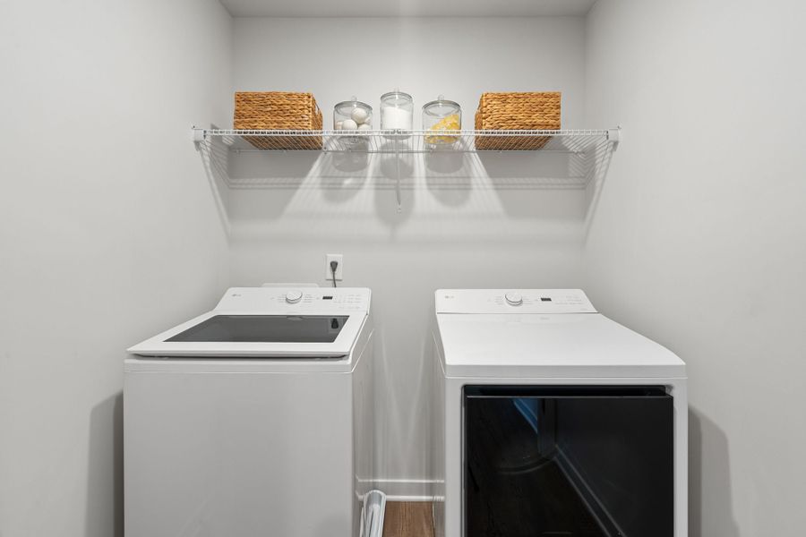 A kitchen with a shelf and a stove. A kitchen with a shelf and a stove.