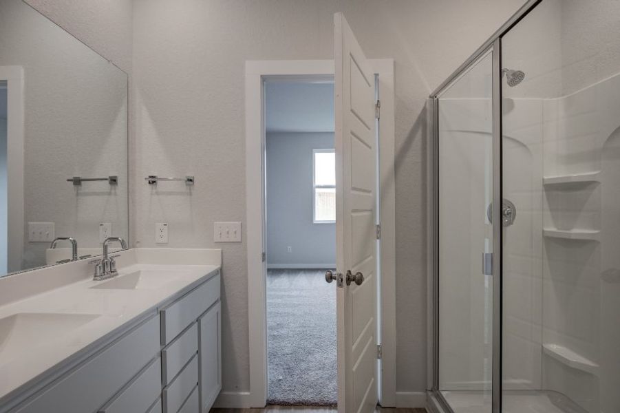 A bathroom with a glass shower.