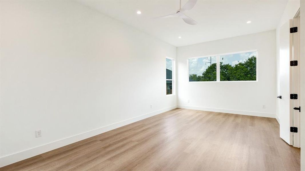 Spare room featuring light hardwood / wood-style flooring and ceiling fan