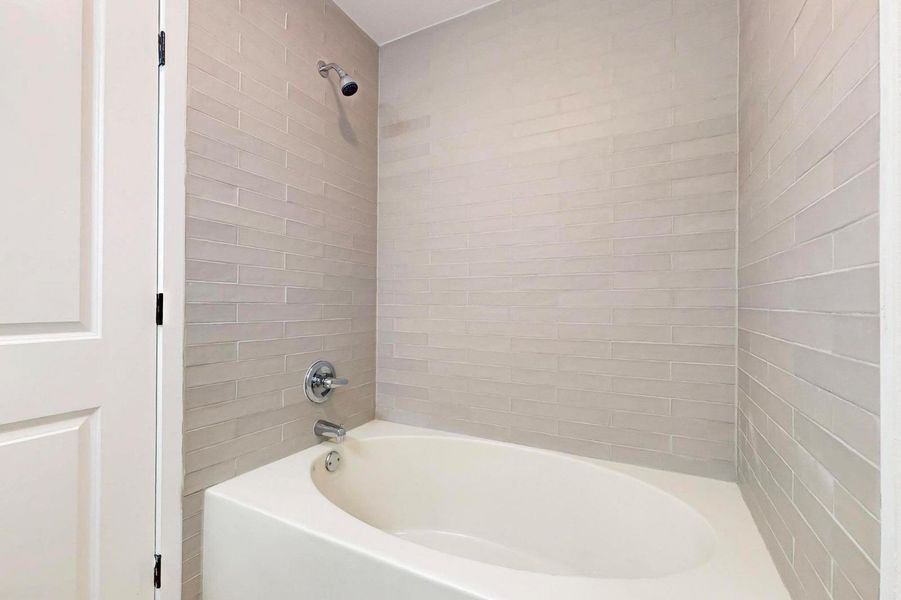 Full bathroom with tub / shower combination