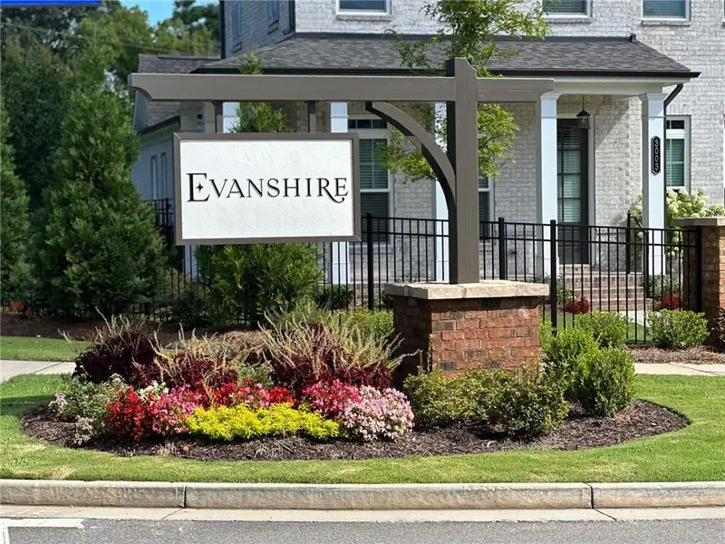 Front exterior of a new home in Evanshire Townhomes, Duluth, GA, highlighting curb appeal (Image 1).