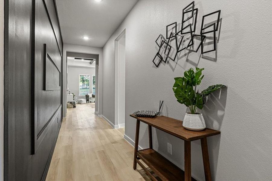 Corridor with light wood-type flooring