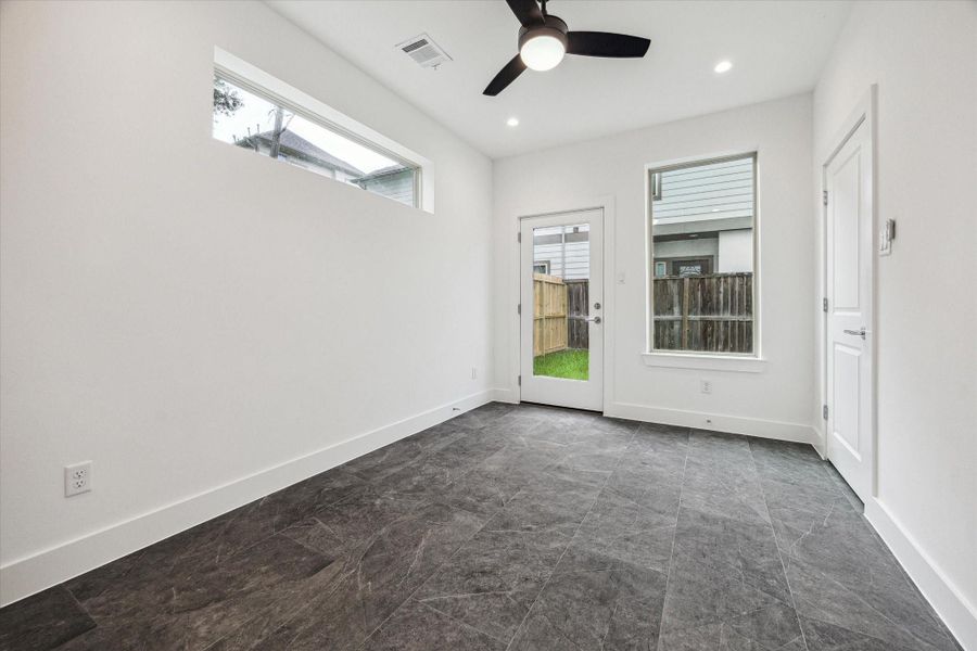 Downstairs Bedroom * Porcelain Tile Floors.