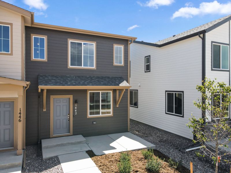 Front exterior of a new home in Spring Valley, Longmont, CO, highlighting curb appeal (Image 2).