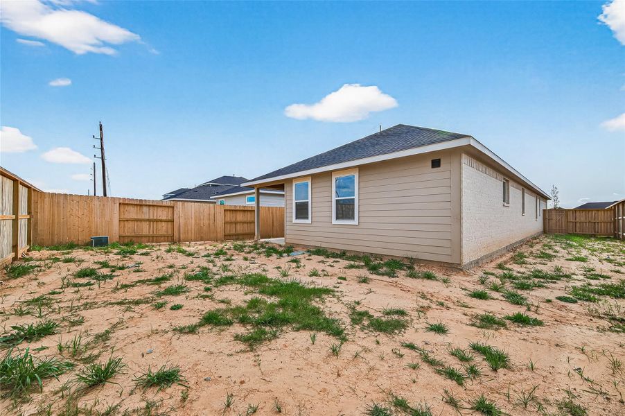 Exterior details and patio area of a home in , Brookshire (Image 29).