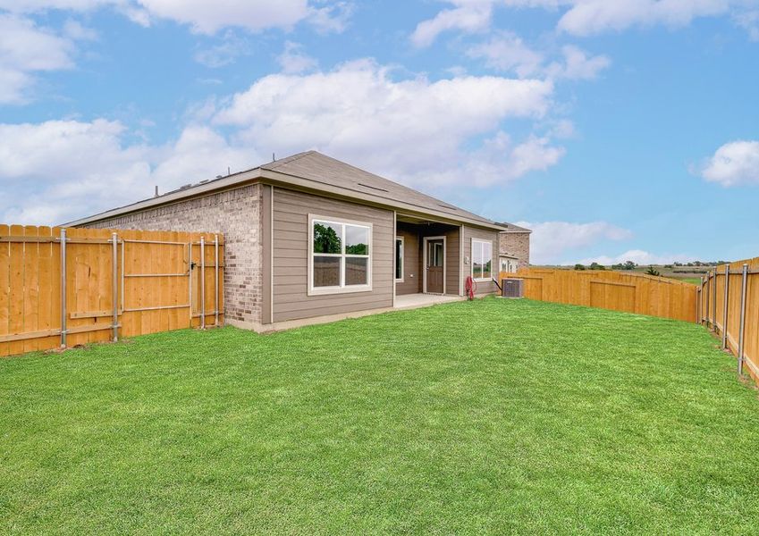The back yard of the Blanco is fully fenced-in. The back yard of the Blanco is fully fenced-in.