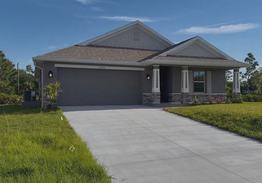 Front exterior of a new home in Gulf Cove, Port Charlotte, FL, highlighting curb appeal (Image 2). Front exterior of a new home in Gulf Cove, Port Charlotte, FL, highlighting curb appeal (Image 2).