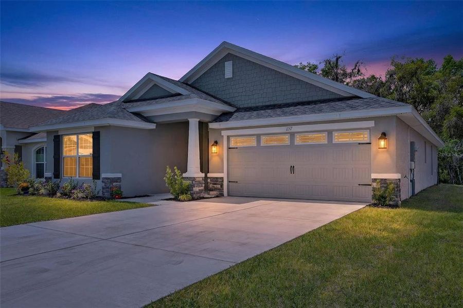 Front exterior of a new home in , Inverness, FL, highlighting curb appeal (Image 24).