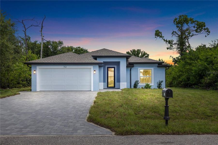 Front exterior of a new home in , Rotonda West, FL, highlighting curb appeal (Image 18).