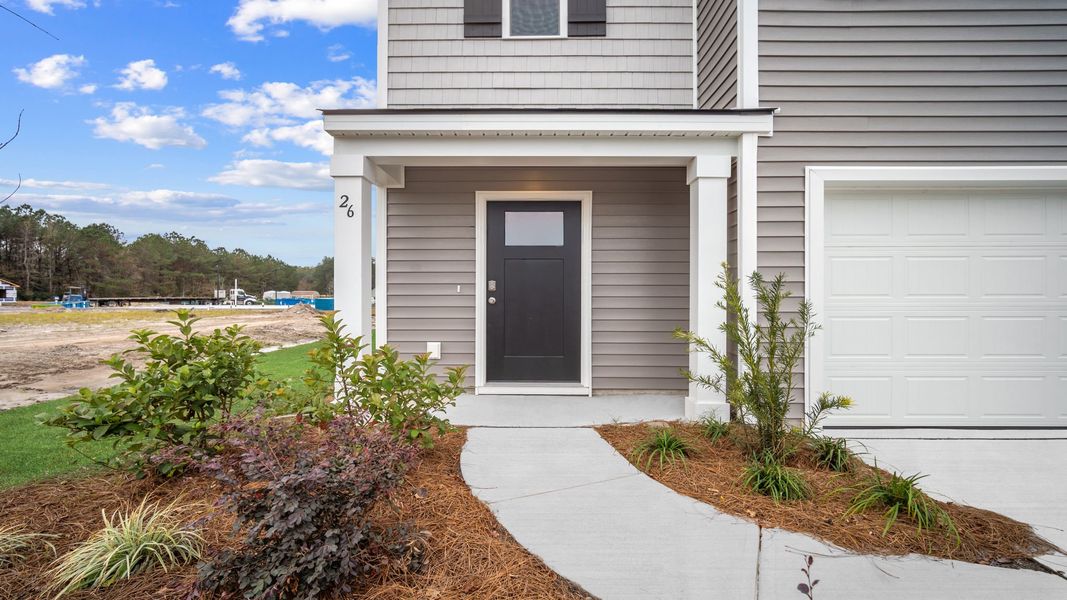 Exterior details and patio area of a home in The Groves at Bees Creek, Ridgeland (Image 2).