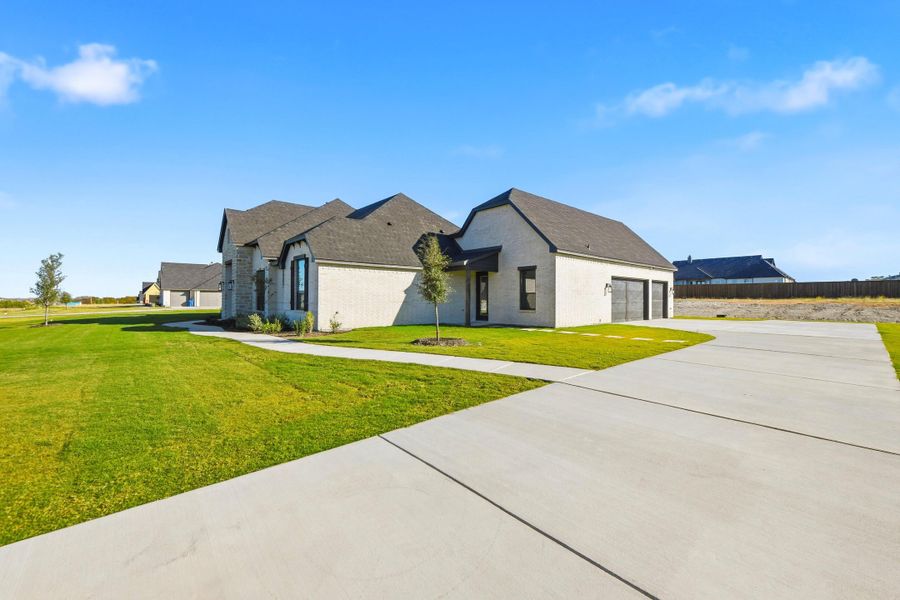 Front exterior of a new home in Aledo Heights - Aledo ISD, Aledo, TX, highlighting curb appeal (Image 27).