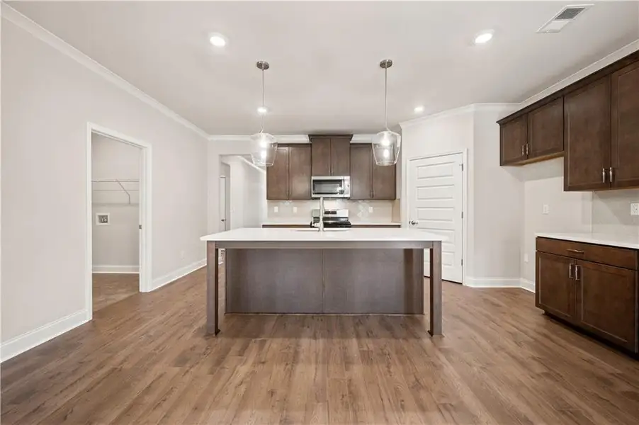 Furnished interior view inside a new home in Oak Ridge Meadows - Active Adult, Locust Grove (Image 6).
