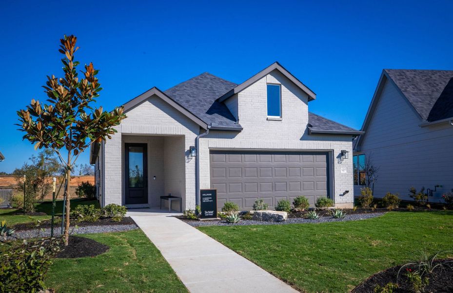 Representative exterior photo of a completed home built from the Hallmark by Del Webb in Del Webb Austin at Lost Pines, Bastrop, TX (Image 38).
