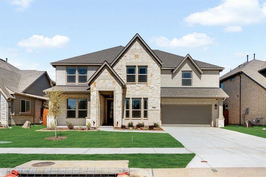 Front exterior of a new home in Glenwood Meadows, Argyle, TX, highlighting curb appeal (Image 2). Front exterior of a new home in Glenwood Meadows, Argyle, TX, highlighting curb appeal (Image 2).