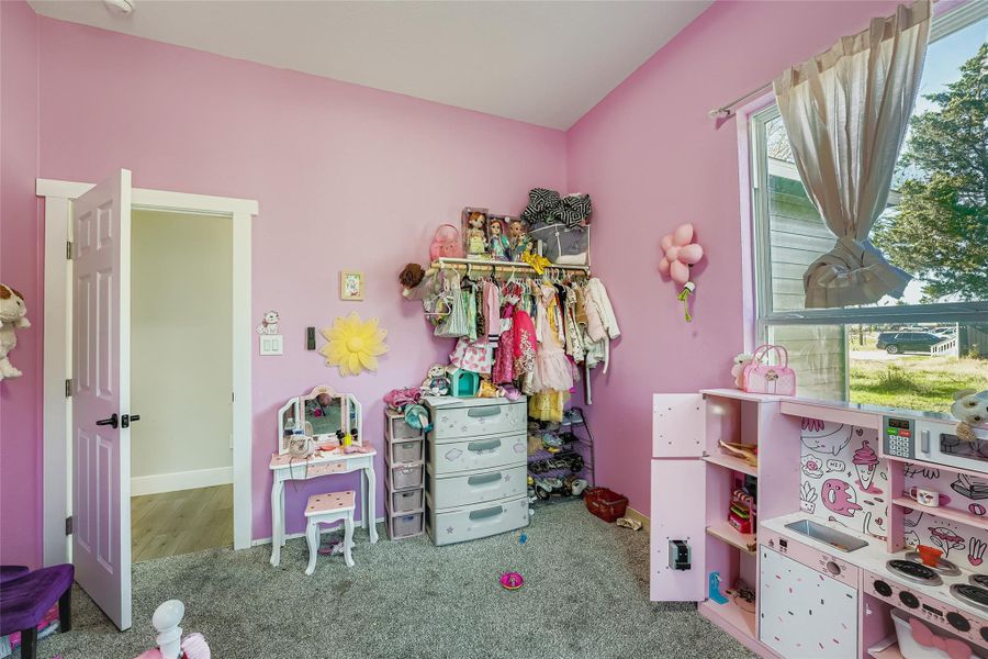 Bedroom featuring carpet flooring and baseboards Bedroom featuring carpet flooring and baseboards