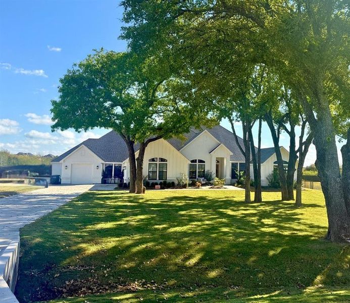 Front exterior of a new home in , Aledo, TX, highlighting curb appeal (Image 2).