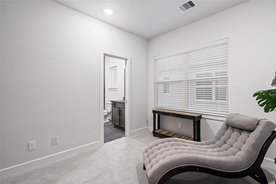 Direct access to the adjacent bath makes this room practical without feeling oversized.