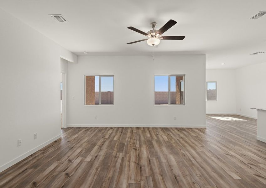 The family room has two large windows that fill the space with natural lighting.
