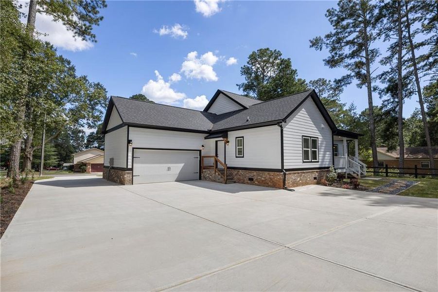 Front exterior of a new home in , Monroe, GA, highlighting curb appeal (Image 27). Front exterior of a new home in , Monroe, GA, highlighting curb appeal (Image 27).