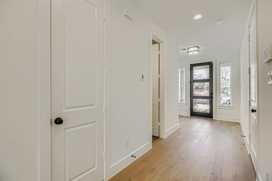 Foyer featuring light wood-style flooring and recessed lighting