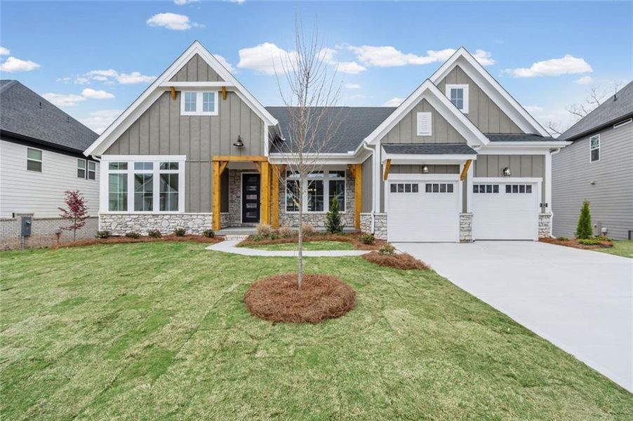 Front exterior of a new home in Twin Lakes, Hoschton, GA, highlighting curb appeal (Image 1). Front exterior of a new home in Twin Lakes, Hoschton, GA, highlighting curb appeal (Image 1).