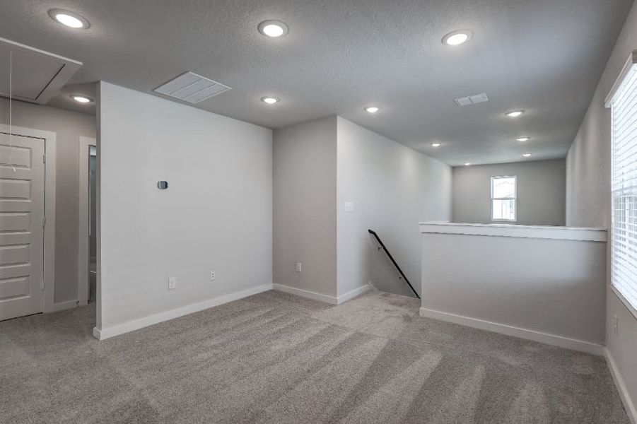 A room with white walls and a white counter top.
