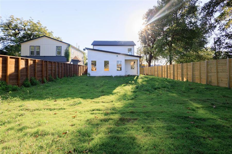 Rear view of house with a fenced backyard Rear view of house with a fenced backyard