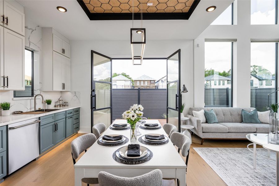 A 6-ft iron and glass door opens to the tranquil, beautifully hardscaped backyard A 6-ft iron and glass door opens to the tranquil, beautifully hardscaped backyard