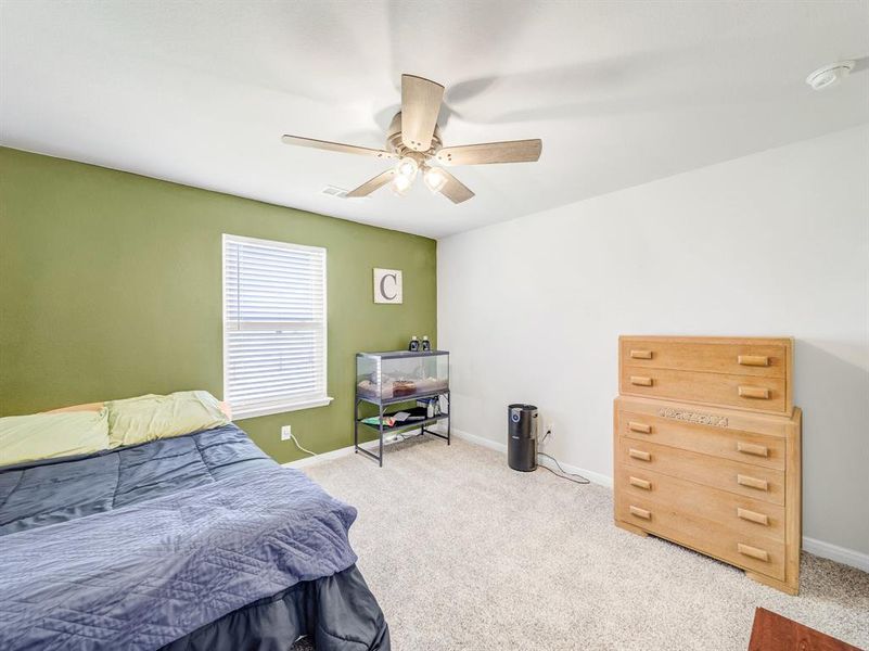 Bedroom featuring carpet floors and ceiling fan