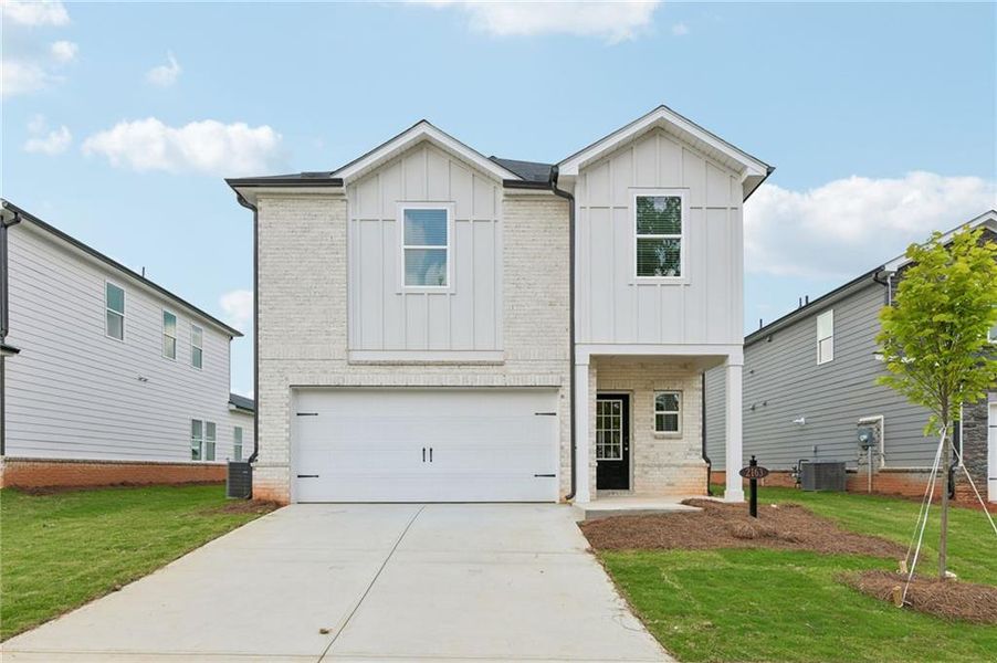 Front exterior of a new home in Martin Springs - Reserve Series, Lawrenceville, GA, highlighting curb appeal (Image 1). Front exterior of a new home in Martin Springs - Reserve Series, Lawrenceville, GA, highlighting curb appeal (Image 1).
