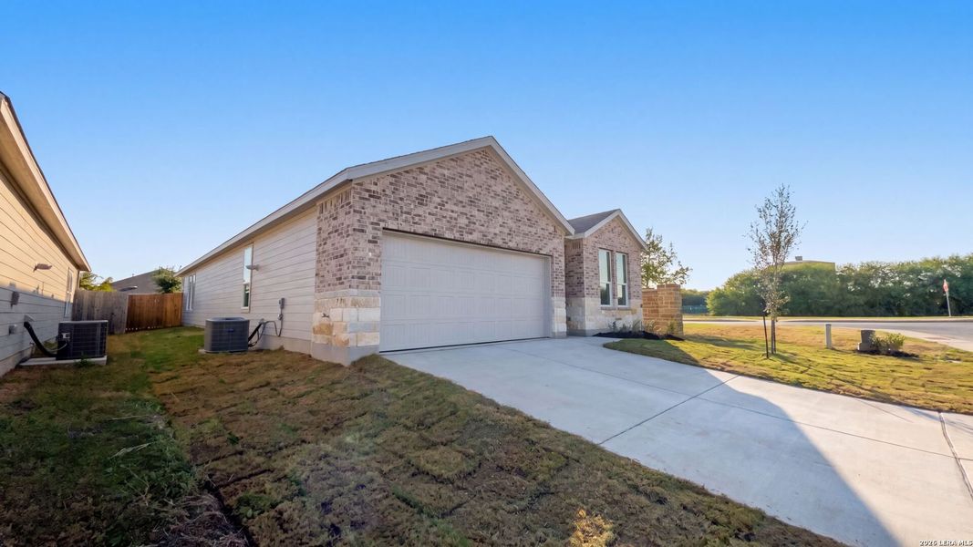Front exterior of a new home in Waterwheel, San Antonio, TX, highlighting curb appeal (Image 2).