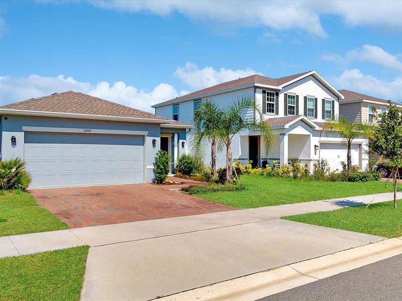 Front exterior of a new home in , Davenport, FL, highlighting curb appeal (Image 24).