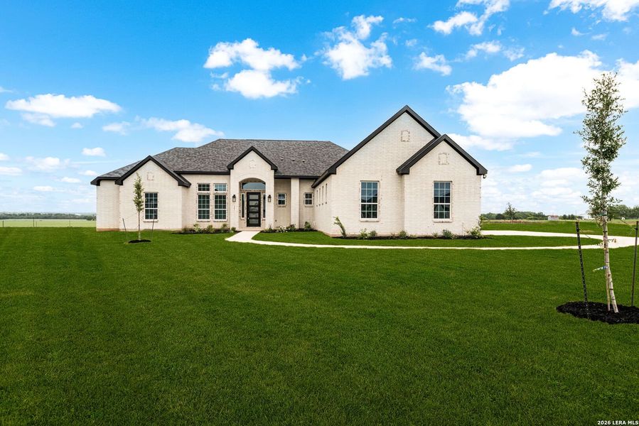 Front exterior of a new home in , Castroville, TX, highlighting curb appeal (Image 28).