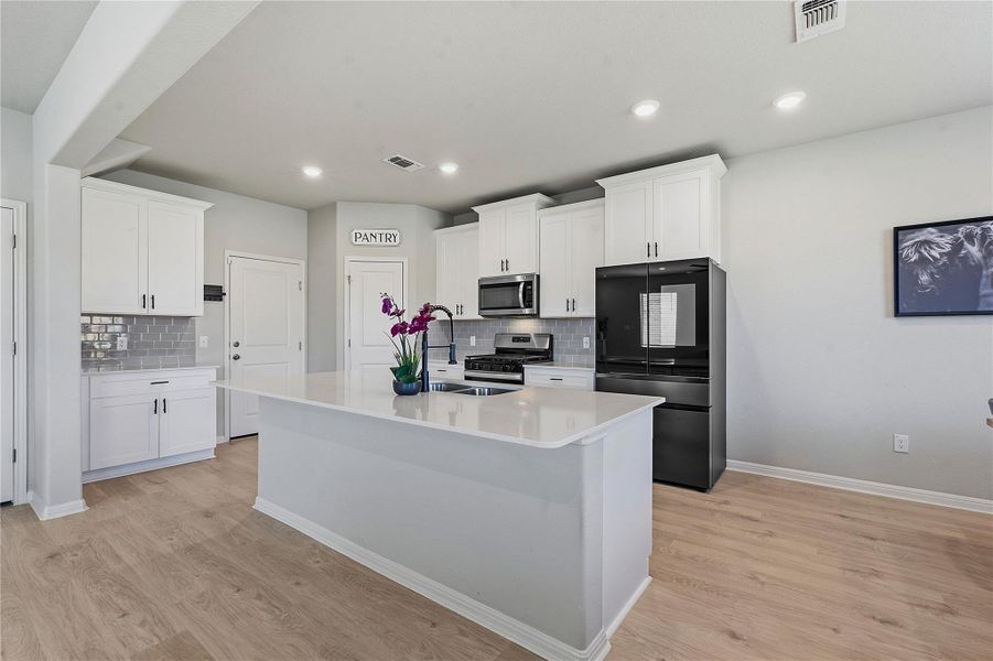 Furnished interior view inside a new home in Crosswinds, Kyle (Image 26).