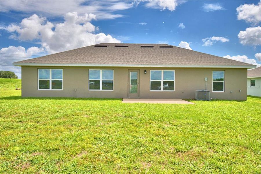 Exterior details and patio area of a home in Cadence Crossing, Auburndale (Image 24).