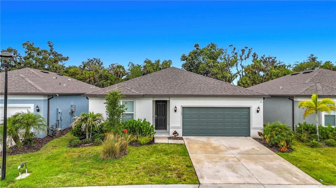 Front exterior of a new home in , Ellenton, FL, highlighting curb appeal (Image 25). Front exterior of a new home in , Ellenton, FL, highlighting curb appeal (Image 25).