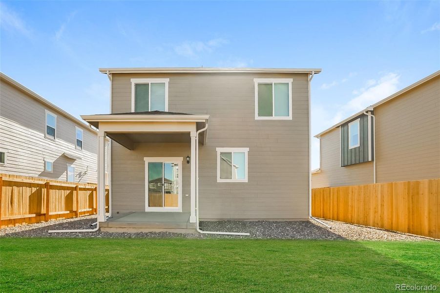 Exterior details and patio area of a home in Second Creek Farm, Commerce City (Image 14).
