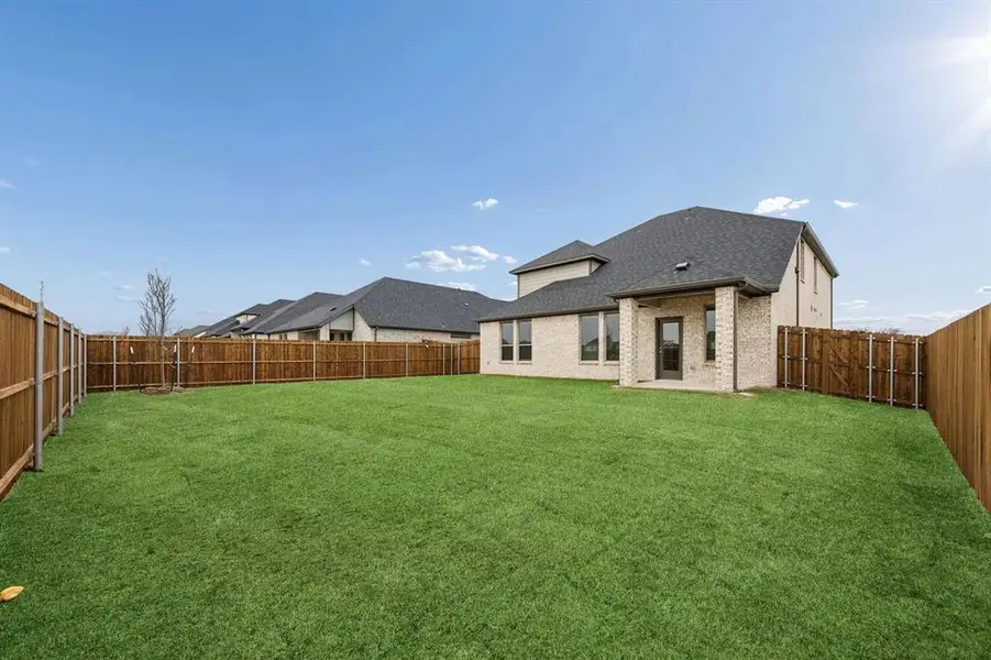 Covered Patio in the Masters home plan by Trophy Signature Homes – REPRESENTATIVE PHOTO