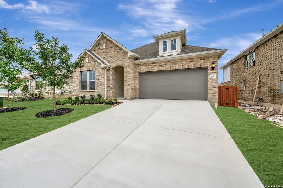 Front exterior of a new home in Meyer Ranch – Select Reserve Series, New Braunfels, TX, highlighting curb appeal (Image 2). Front exterior of a new home in Meyer Ranch – Select Reserve Series, New Braunfels, TX, highlighting curb appeal (Image 2).